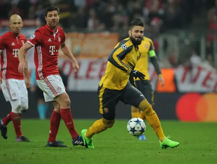Framed Print : Olivier Giroud Breaks Past Xabi Alonso: Arsenal vs. Bayern Munich, UEFA Champions League Round of 16 - First Leg Framed Print : Olivier Giroud Breaks Past Xabi Alonso: Arsenal vs. Bayern Munich, UEFA Champions League Round of 16 - First Leg