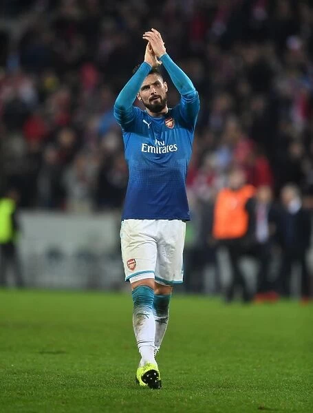 Olivier Giroud Celebrates with Arsenal Fans after UEFA Europa League Victory over FC Koln