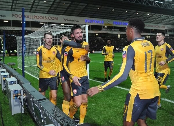 Olivier Giroud celebrates scoring Arsenals 2nd goal with Aaron Ramsey and Alex Iwobi