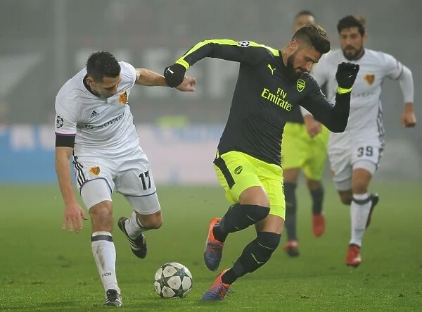 Olivier Giroud Faces Off Against Marek Suchy in FC Basel vs. Arsenal UEFA Champions League Clash (December 2016)