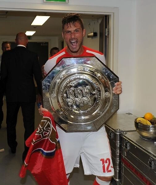 Olivier Giroud Lifts the FA Community Shield: Arsenal's Victory over Manchester City (2014)