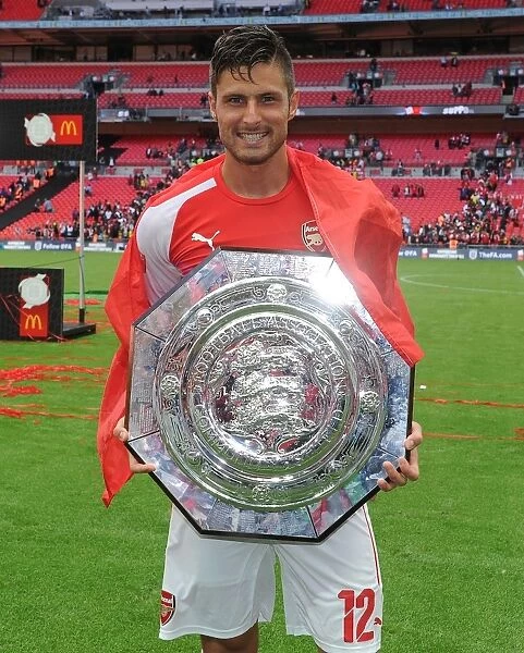 Olivier Giroud Lifts the FA Community Shield: Arsenal's Victory over Manchester City (August 2014)