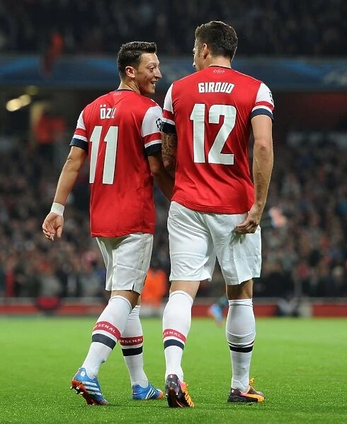 Olivier Giroud and Mesut Ozil Celebrate Arsenal's Second Goal vs. Napoli (2013-14)