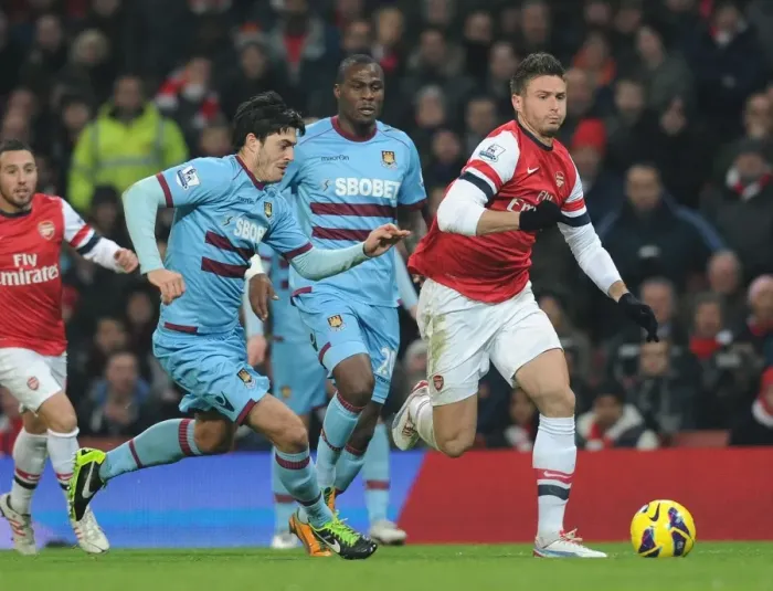 Framed Print : Olivier Giroud Outmaneuvers Guy Demel: Arsenal vs. West Ham United, Premier League 2012-13