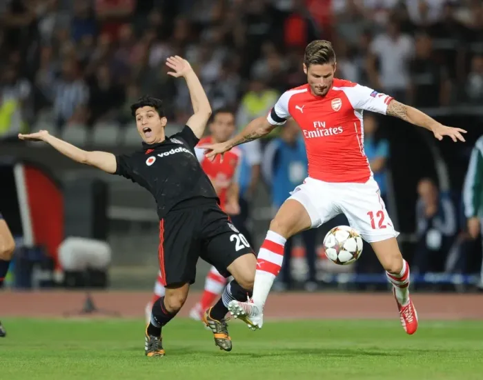 Framed Print : Olivier Giroud Outmaneuvers Necip Uysal in Arsenal's UEFA Champions League Clash vs Besiktas