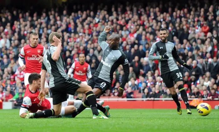 Framed Print : Olivier Giroud Scores Dramatic Goal Against William Gallas in Arsenal vs. Tottenham Rivalry (2012-13)