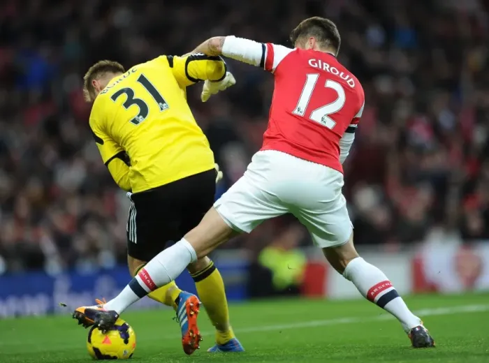 Framed Print : Olivier Giroud tackles Artur Boruc (Southampton) on his way to scoring Arsenals 1st goal