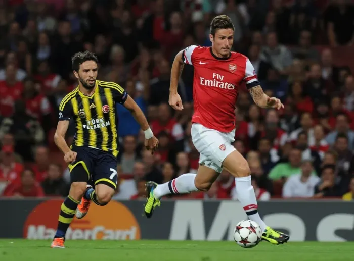 Framed Print : Olivier Giroud vs. Gokhan Gonul: Arsenal's Edge in Champions League Showdown (Arsenal v Fenerbahce 2013-14)