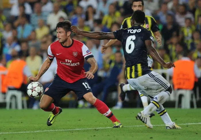 Framed Print : Olivier Giroud vs. Joseph Yobo: Arsenal's Edge in UEFA Champions League Play-offs against Fenerbahce