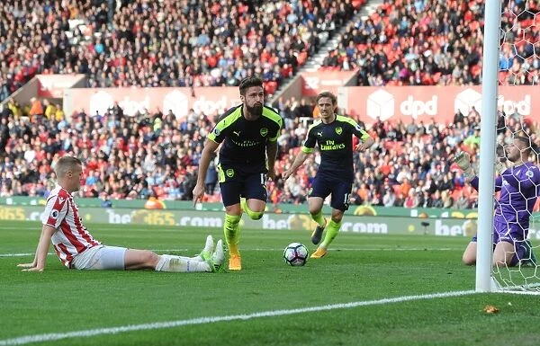 Olivier Giroud's Brace: Arsenal Crush Stoke City in Premier League Showdown