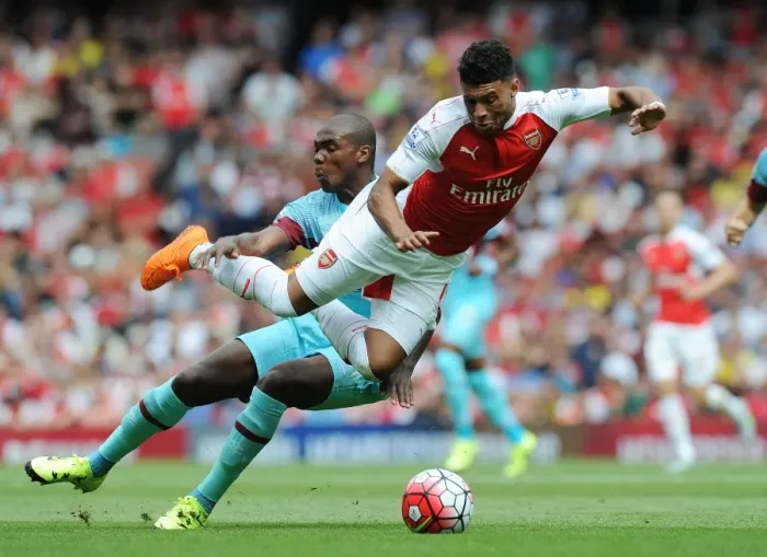 Framed Print : Oxlade-Chamberlain vs. Ogbonna: Intense Clash Between Arsenal's Winger and West Ham's Defender in 2015-16 Premier League Framed Print : Oxlade-Chamberlain vs. Ogbonna: Intense Clash Between Arsenal's Winger and West Ham's Defender in 2015-16 Premier League