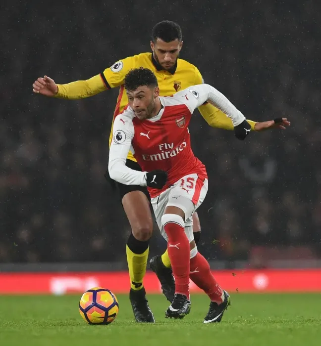 Framed Print : Oxlade-Chamberlain vs. Capoue: A Midfield Battle at the Emirates Stadium, Premier League 2016-17