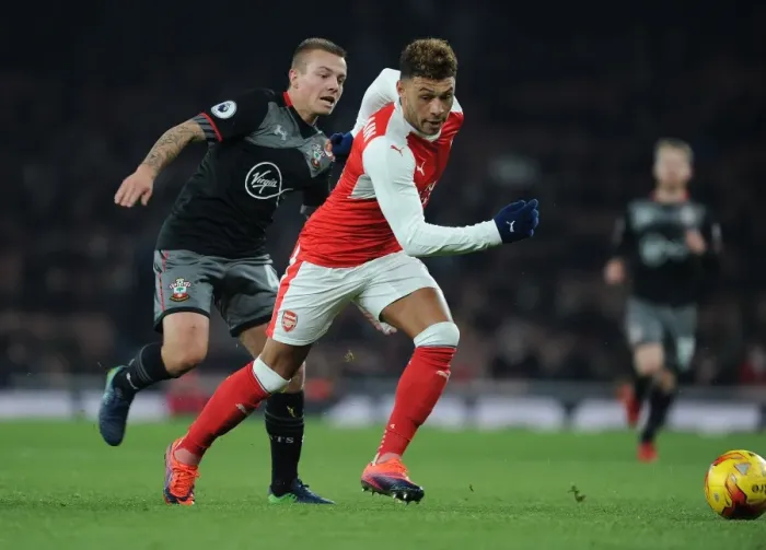 Framed Print : Oxlade-Chamberlain vs Clasie: A Battle in the EFL Cup Quarter-Final between Arsenal and Southampton Framed Print : Oxlade-Chamberlain vs Clasie: A Battle in the EFL Cup Quarter-Final between Arsenal and Southampton