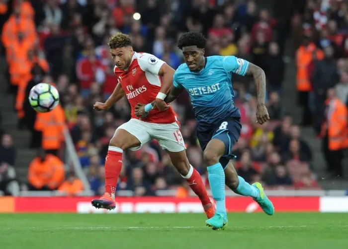 Framed Print : Oxlade-Chamberlain vs. Fer: A Premier League Showdown at Emirates Stadium