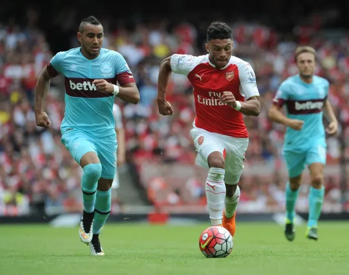 Framed Print : Oxlade-Chamberlain vs. Payet: Clash of the Stars in Arsenal vs. West Ham Premier League Showdown
