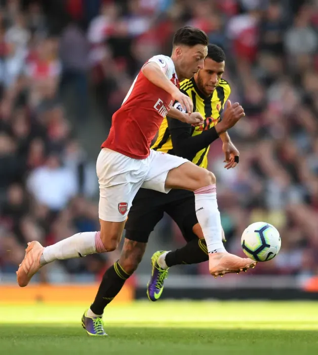 Framed Print : Ozil vs. Capoue: A Football Battle at the Emirates - Arsenal vs. Watford, Premier League 2018-19