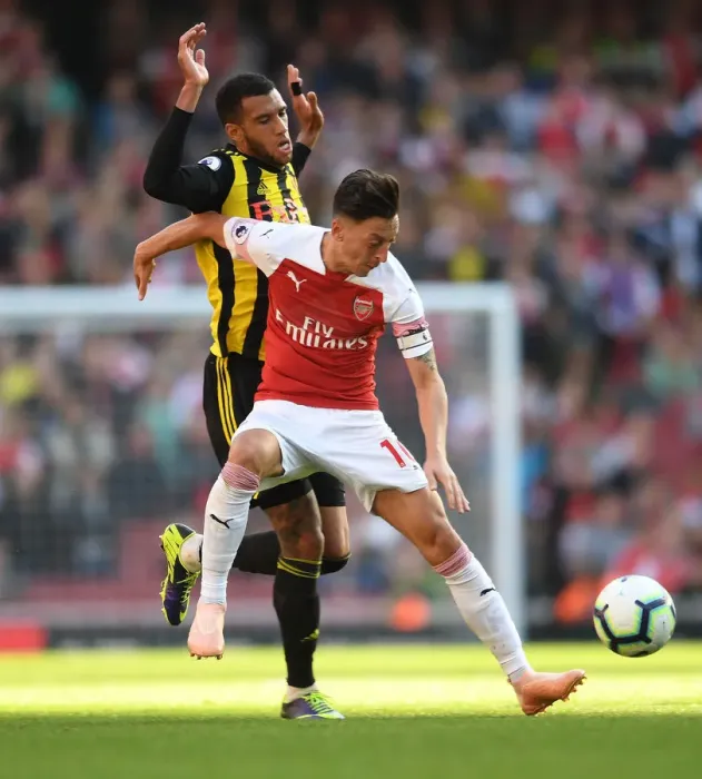 Framed Print : Ozil vs. Capoue: A Premier League Battle at the Emirates Framed Print : Ozil vs. Capoue: A Premier League Battle at the Emirates