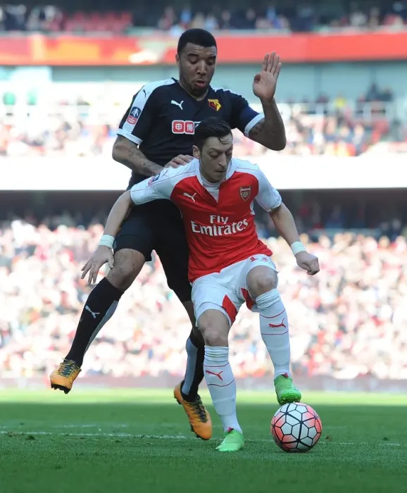 Framed Print : Ozil vs. Deeney: FA Cup Sixth Round Clash at Arsenal