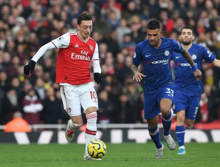 Framed Print : Ozil vs. Emerson: A Premier League Showdown at the Emirates Framed Print : Ozil vs. Emerson: A Premier League Showdown at the Emirates