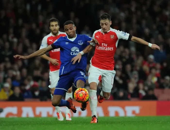 Framed Print : Ozil vs. Galloway: A Premier League Battle at Emirates Stadium