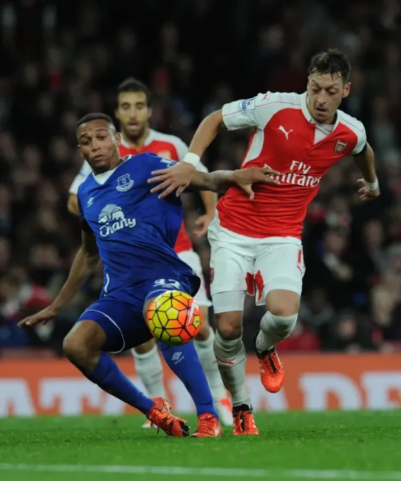 Framed Print : Ozil vs. Galloway: A Premier League Showdown at Emirates Stadium