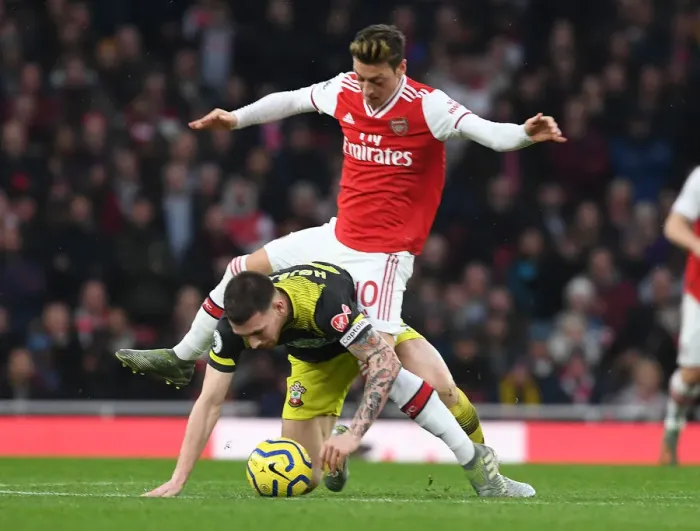 Framed Print : Ozil vs Hojbjerg: A Premier League Showdown at the Emirates