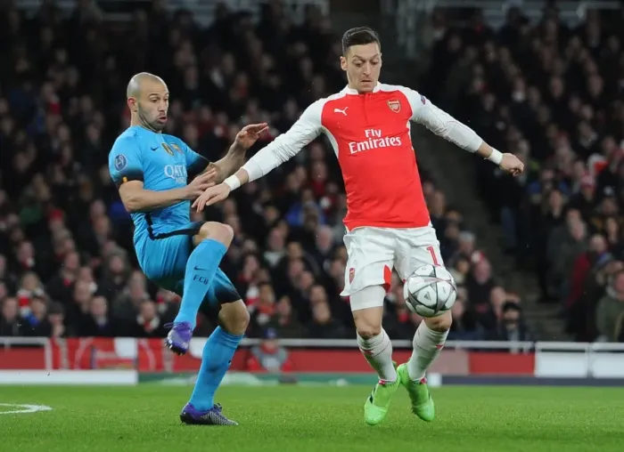 Framed Print : Ozil vs. Mascherano: A Champions League Battle at the Emirates