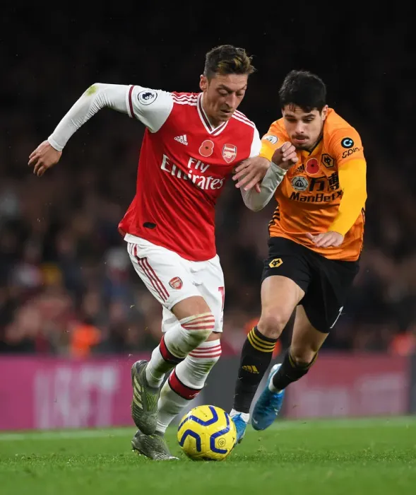 Framed Print : Ozil vs. Neto: Clash of the Playmakers in Arsenal vs. Wolverhampton Wanderers Premier League Showdown (November 2019) Framed Print : Ozil vs. Neto: Clash of the Playmakers in Arsenal vs. Wolverhampton Wanderers Premier League Showdown (November 2019)