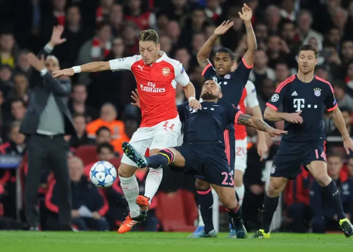 Framed Print : Ozil vs. Vidal: A Champions League Showdown - Arsenal vs. Bayern Munich