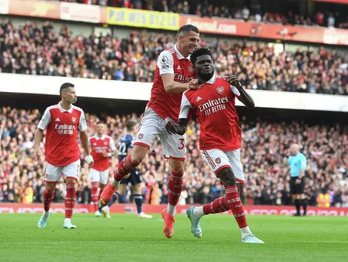 Framed Print : Partey and Xhaka Celebrate Arsenal's Four-Goal Lead Over Nottingham Forest (2022-23)