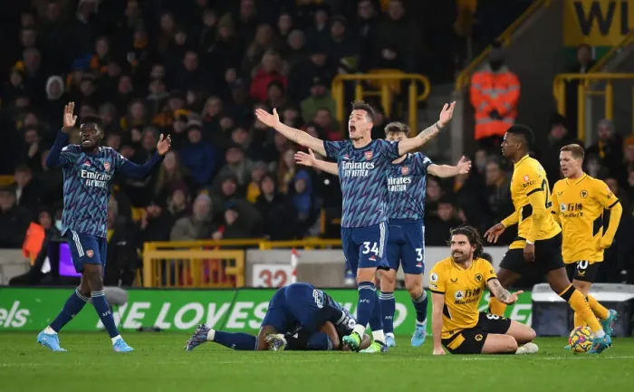 Framed Print : Partey and Xhaka's Appeal: Wolverhampton Wanderers vs Arsenal, Premier League 2021-22