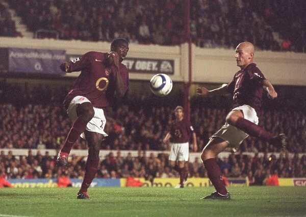 Pascal Cygan scores his 2nd and Arsenals 4th goal past Kolo Toure