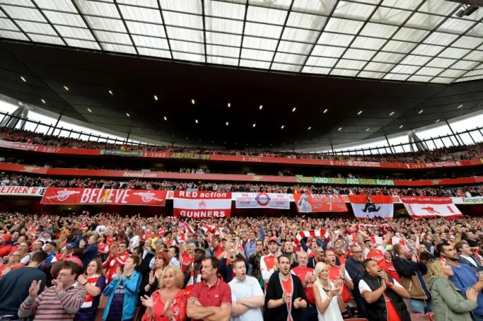 Framed Print : Passionate Arsenal Fans Unveil Banners Ahead of Arsenal vs. Tottenham Rivalry at Emirates Stadium