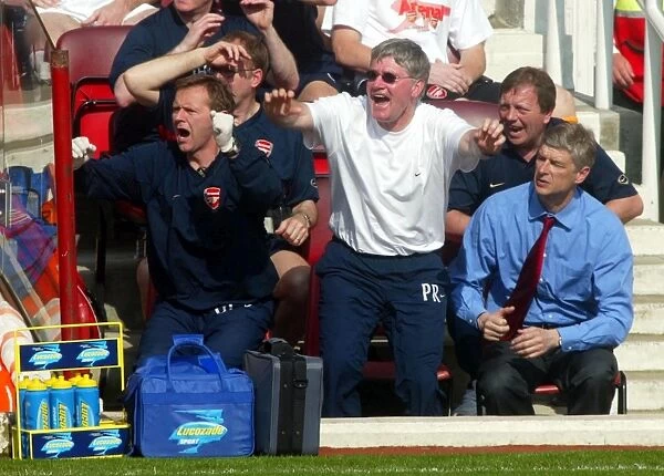 Pat Rice (Assistant Manager) Gary Lewin (Physio) and Arsene Wenger (Arsenal Manager) celebrate an Ar