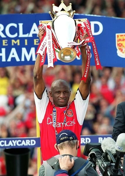 Patrick Vieira lifts the Premiership trophy after the match