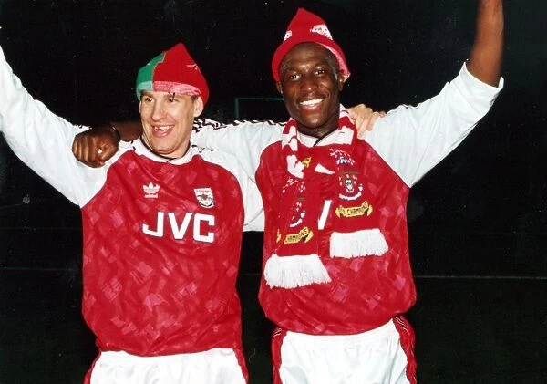 Paul Merson and Kevin Campbell celebrate winning the League Championship