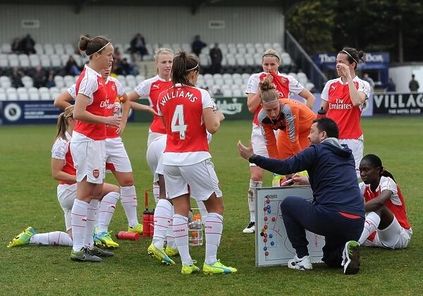 Pedro Martinez Losa the Arsenal Ladies Manager talks to the team before extra time