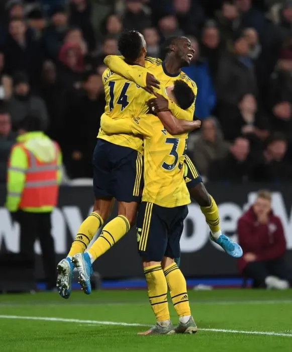 Framed Print : Pepe, Aubameyang, and Martinelli Celebrate Arsenal's Winning Goals Against West Ham United (December 2019)