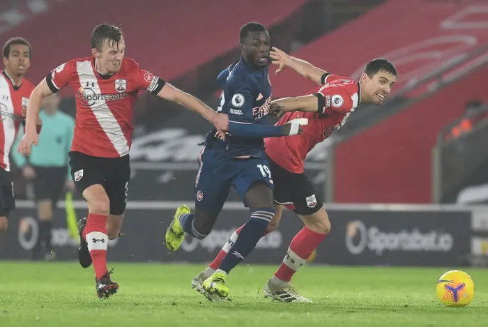 Framed Print : Pepe Breaks Past Southampton Defenders in Empty St. Mary's Stadium - Southampton vs Arsenal, Premier League 2020-21