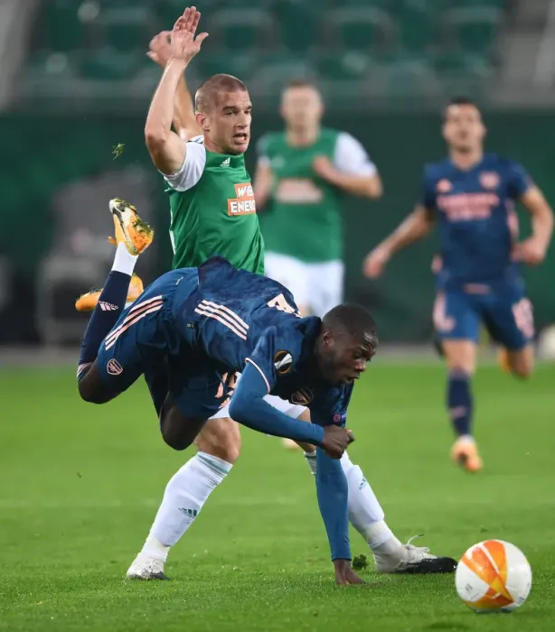 Framed Print : Pepe Foul: Intense Moment in Rapid Vienna vs. Arsenal UEFA Europa League Clash Framed Print : Pepe Foul: Intense Moment in Rapid Vienna vs. Arsenal UEFA Europa League Clash