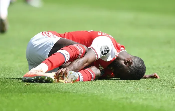 Framed Print : Pepe Suffers Injury in Empty Premier League Clash: Brighton vs. Arsenal (2019-20) Framed Print : Pepe Suffers Injury in Empty Premier League Clash: Brighton vs. Arsenal (2019-20)