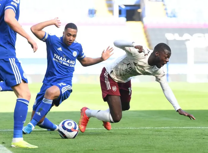 Framed Print : Pepe Tripped by Tielemans: Leicester vs. Arsenal, 2021 Premier League Clash Amidst Empty Stands