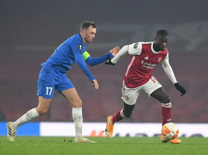 Framed Print : Pepe vs Aursnes: Arsenal's Star Forward Clashes with Molde's Defender in Europa League Showdown