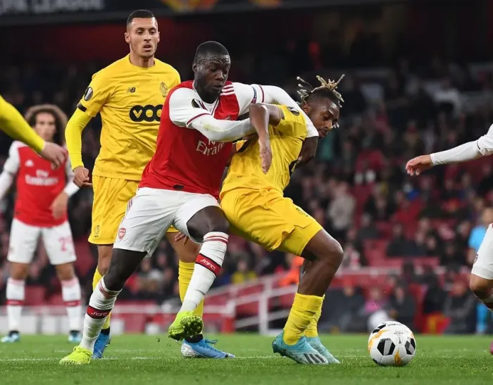 Framed Print : Pepe vs Bastien: Intense Clash in Arsenal's Europa League Match against Standard Liege Framed Print : Pepe vs Bastien: Intense Clash in Arsenal's Europa League Match against Standard Liege