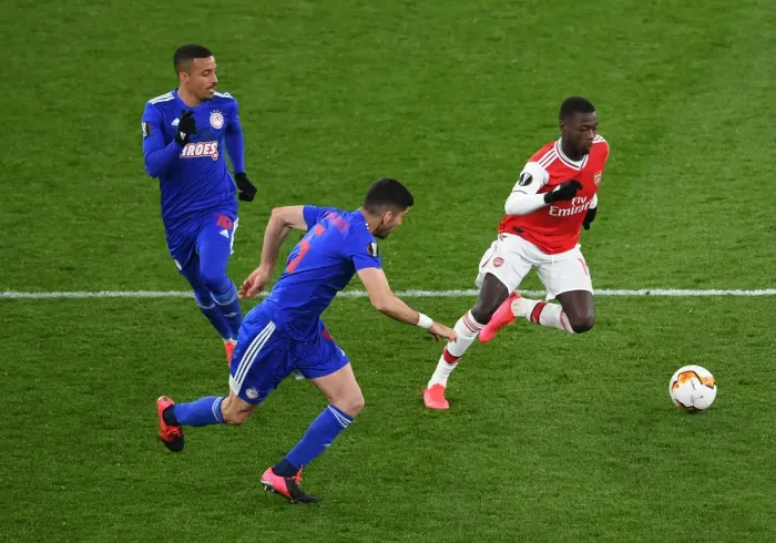 Framed Print : Pepe vs. Bouchalakis: Intense Clash in Arsenal's Europa League Battle against Olympiacos