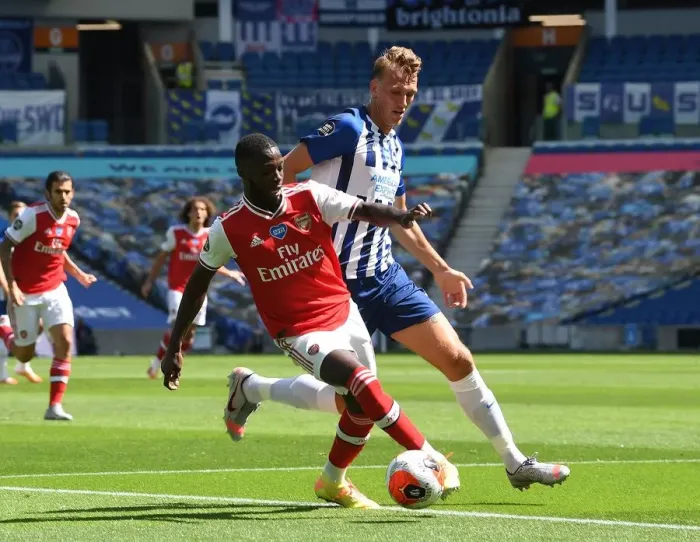 Framed Print : Pepe vs Burn: Empty Stadium Showdown - Brighton & Hove Albion vs Arsenal FC, Premier League 2019-2020 Framed Print : Pepe vs Burn: Empty Stadium Showdown - Brighton & Hove Albion vs Arsenal FC, Premier League 2019-2020