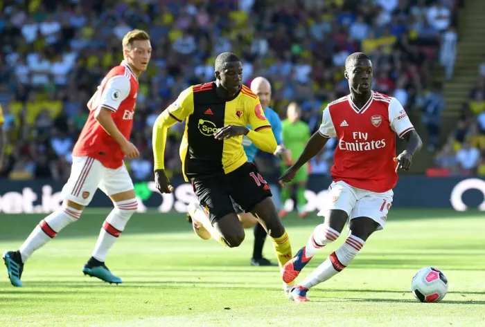 Framed Print : Pepe vs Doucoure: Intense Moment from Watford vs Arsenal Premier League Clash