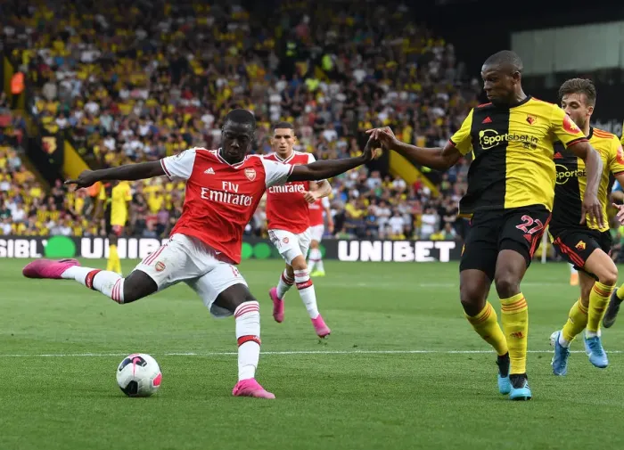 Framed Print : Pepe vs Kabasele: Clash at Vicarage Road - Arsenal vs Watford, Premier League 2019-20 Framed Print : Pepe vs Kabasele: Clash at Vicarage Road - Arsenal vs Watford, Premier League 2019-20