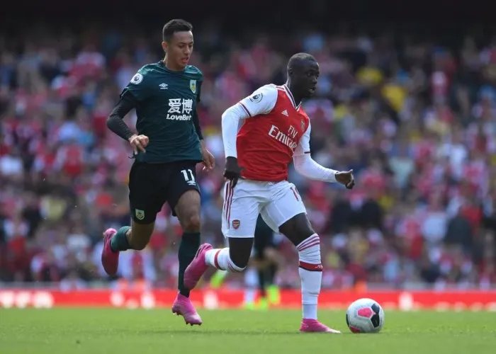 Framed Print : Pepe vs McNeil: Intense Face-Off in Arsenal's Battle Against Burnley