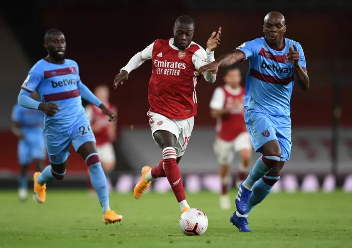 Framed Print : Pepe vs Ogbonna: Intense Battle in Arsenal vs West Ham Premier League Clash